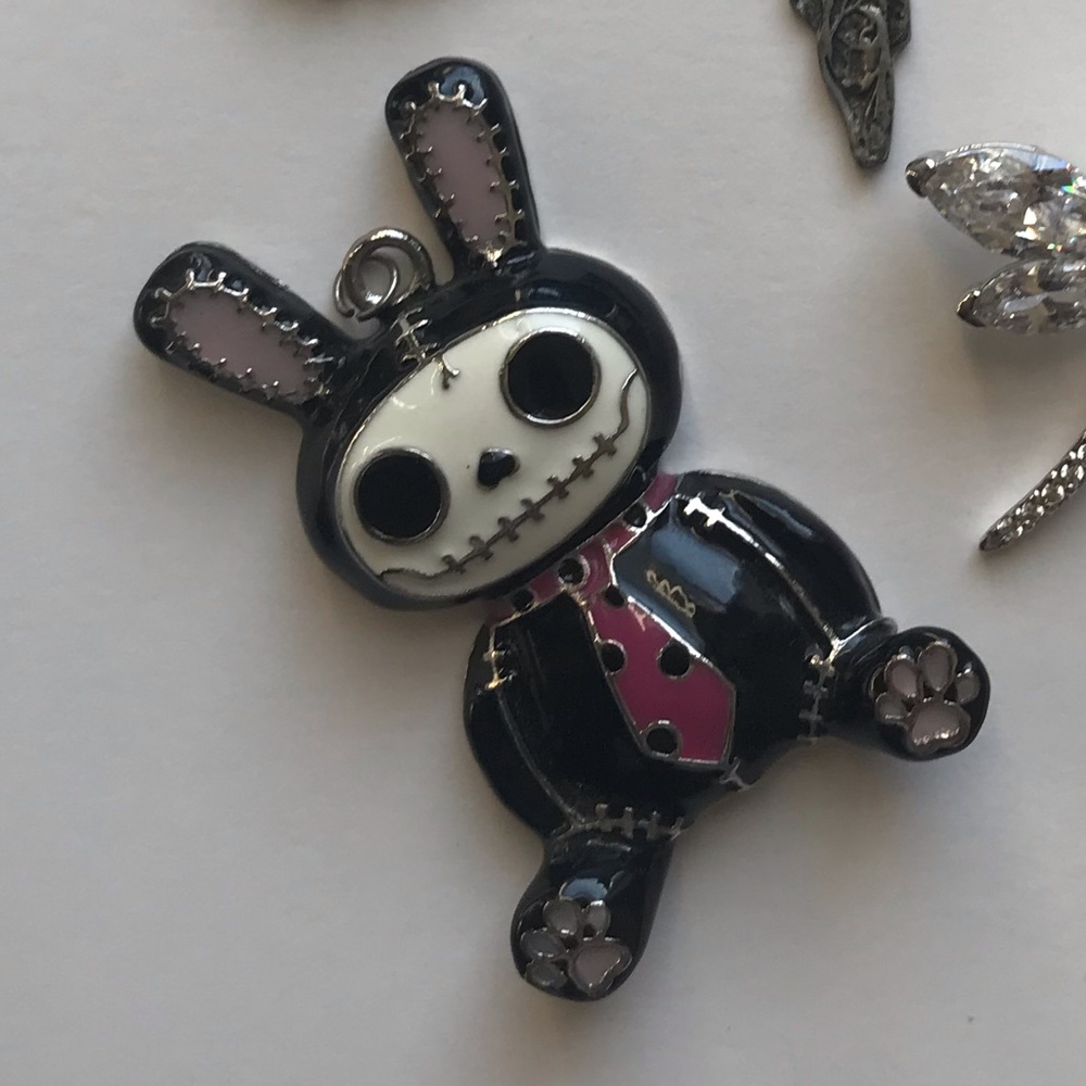Adorable dead bunny charm pre-owned chain not included.
